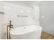 Bright bathroom with stylish free standing tub at 4819 Elam Rd, Stone Mountain, GA 30083