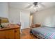 Cozy bedroom featuring wood floors, ceiling fan, and a well-lit ambiance at 4819 Elam Rd, Stone Mountain, GA 30083