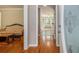 Inviting entryway featuring hardwood floors, neutral wall paint, and decorative glass door, leading to spacious living areas at 4819 Elam Rd, Stone Mountain, GA 30083