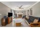 Cozy living room features a brick fireplace, neutral walls, and tile flooring at 4819 Elam Rd, Stone Mountain, GA 30083
