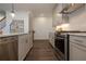 Updated kitchen with stainless steel appliances and white countertops at 1011 Crown Oak St # 47, Johns Creek, GA 30022