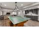 Finished basement with a ping pong table, bar area, and cozy living space at 141 Ennisbrook Se Dr, Smyrna, GA 30082