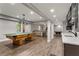 Spacious finished basement with a ping pong table, bar, and entertainment area at 141 Ennisbrook Se Dr, Smyrna, GA 30082