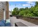 Spacious backyard deck with outdoor seating, a grill, string lights, brown siding, and a great view of the backyard at 141 Ennisbrook Se Dr, Smyrna, GA 30082