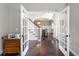Bright foyer with hardwood floors, staircase, and an archway leading to the dining room at 141 Ennisbrook Se Dr, Smyrna, GA 30082
