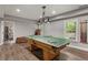 Basement game room with a ping pong table and adjacent workout room at 141 Ennisbrook Se Dr, Smyrna, GA 30082
