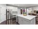 Modern kitchen with island, white cabinets, and stainless steel refrigerator at 141 Ennisbrook Se Dr, Smyrna, GA 30082