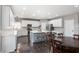 Modern kitchen with white cabinets, stainless steel appliances, and central island at 141 Ennisbrook Se Dr, Smyrna, GA 30082