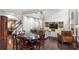 Open concept living area with hardwood floors and staircase at 141 Ennisbrook Se Dr, Smyrna, GA 30082