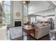 Spacious living room with high ceilings, large windows, fireplace, and hardwood floors at 141 Ennisbrook Se Dr, Smyrna, GA 30082