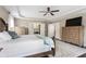 Spacious main bedroom has hardwood floors, a ceiling fan, with access to the bathroom and closet at 141 Ennisbrook Se Dr, Smyrna, GA 30082