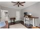 Bright home office with hardwood floors, a ceiling fan, and a modern desk at 141 Ennisbrook Se Dr, Smyrna, GA 30082
