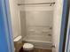 A bathroom with a bathtub and shower with a vanity and toilet at 3015 Liberty Nw Way, Atlanta, GA 30318