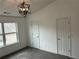 A bright bedroom with a vaulted ceiling, carpeted floors, and two closets for ample storage at 3015 Liberty Nw Way, Atlanta, GA 30318