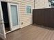Private deck area featuring wood panel and a door to the interior at 3015 Liberty Nw Way, Atlanta, GA 30318