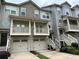 Beautiful townhome exterior with private balconies and garage parking at 3015 Liberty Nw Way, Atlanta, GA 30318