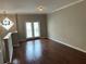 Bright living room featuring hardwood floors, neutral walls, and a diamond accent window at 3015 Liberty Nw Way, Atlanta, GA 30318