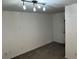 Bright living room features contemporary track lighting and plush gray carpeting at 3015 Liberty Nw Way, Atlanta, GA 30318