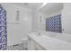 Bright bathroom featuring a modern vanity, stylish floors, and patterned shower curtain at 3383 Spirit Nw Dr, Kennesaw, GA 30144