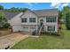 Charming two-story home with a two-car garage and well-maintained front yard at 3383 Spirit Nw Dr, Kennesaw, GA 30144