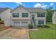 Charming two-story home with a two-car garage and well-maintained front yard at 3383 Spirit Nw Dr, Kennesaw, GA 30144