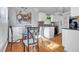 Eat-in kitchen features white cabinetry and stainless steel appliances at 3383 Spirit Nw Dr, Kennesaw, GA 30144