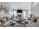 Inviting living room features a fireplace, large windows, and comfortable couches for relaxation at 3383 Spirit Nw Dr, Kennesaw, GA 30144