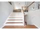 Interior shot of wooden stairs with white risers and railing leading to upper floor at 3383 Spirit Nw Dr, Kennesaw, GA 30144