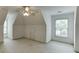 Bedroom with carpet flooring and windows offering natural light at 3871 Lake Juliette Dr, Buford, GA 30519