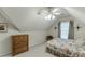 Bedroom featuring a ceiling fan and a window with curtains at 3871 Lake Juliette Dr, Buford, GA 30519