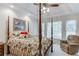 Relaxing main bedroom with trey ceiling, soft natural light, and sitting area at 3871 Lake Juliette Dr, Buford, GA 30519