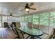 Spacious screened porch with wood floors and views to the outdoors, perfect for relaxation and entertaining at 3871 Lake Juliette Dr, Buford, GA 30519