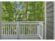 A balcony overlooking a peaceful wooded area, perfect for relaxing at 545 Woodman Pl, Roswell, GA 30076