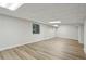 Bright basement space with large windows and durable flooring offers versatility at 545 Woodman Pl, Roswell, GA 30076