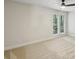 Neutral bedroom with carpet flooring, ceiling fan, and double windows allowing natural light at 545 Woodman Pl, Roswell, GA 30076
