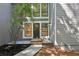 A home's front entrance shows stone steps and an elegant doorway with a gray-tone color scheme at 545 Woodman Pl, Roswell, GA 30076