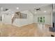 Inviting living room features hardwood floors, fireplace, and stairs to the second floor at 545 Woodman Pl, Roswell, GA 30076