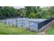 Overhead view of fenced pickleball courts, benches, and professional lighting at 545 Woodman Pl, Roswell, GA 30076