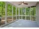 Screened-in porch offers a relaxing outdoor space with wooded views and natural light at 545 Woodman Pl, Roswell, GA 30076