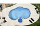 Aerial view of pool with lounge chairs and hot tub in a spacious backyard, ideal for summer relaxation at 116 Archstone Sq, Mcdonough, GA 30253