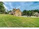 Spacious backyard featuring a pool, landscaped lawn, and a private setting, perfect for outdoor enjoyment at 116 Archstone Sq, Mcdonough, GA 30253