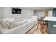 Finished basement features a bar, modern sectional and ample lighting at 116 Archstone Sq, Mcdonough, GA 30253