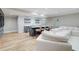 Finished basement features a wet bar, wine storage and comfortable white sectional seating at 116 Archstone Sq, Mcdonough, GA 30253