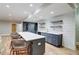 Finished basement features a wet bar with seating and beverage storage at 116 Archstone Sq, Mcdonough, GA 30253