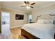 Bedroom with ceiling fan and walk in closet, features wood laminate flooring at 116 Archstone Sq, Mcdonough, GA 30253