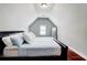 Well-lit bedroom with angled ceilings, modern furniture, and an inviting atmosphere at 116 Archstone Sq, Mcdonough, GA 30253