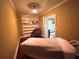 Relaxing room with a massage table, built-in shelves, and calming colors to unwind at 116 Archstone Sq, Mcdonough, GA 30253