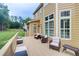 Outdoor deck with cushioned chairs, offering a relaxing space for entertaining and enjoying the backyard views at 116 Archstone Sq, Mcdonough, GA 30253