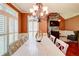 Formal dining room featuring a long white wood table, chandelier and stone fireplace at 116 Archstone Sq, Mcdonough, GA 30253