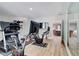 Home gym featuring exercise machines, a TV, and ample lighting at 116 Archstone Sq, Mcdonough, GA 30253